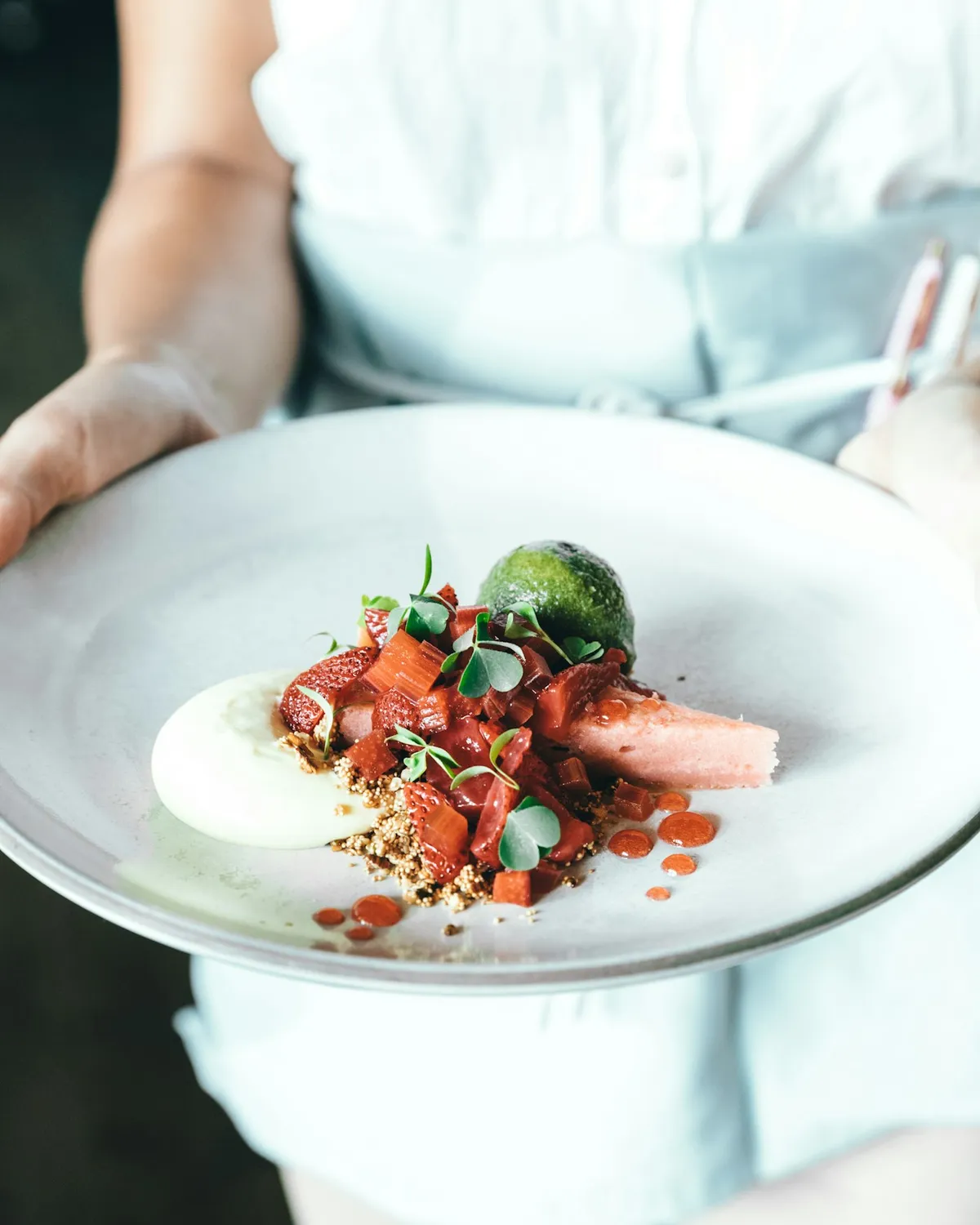 A chef finishing a dish